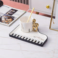 Pianissimo smaku – elegante set di tazza e vassoio per amanti della musica