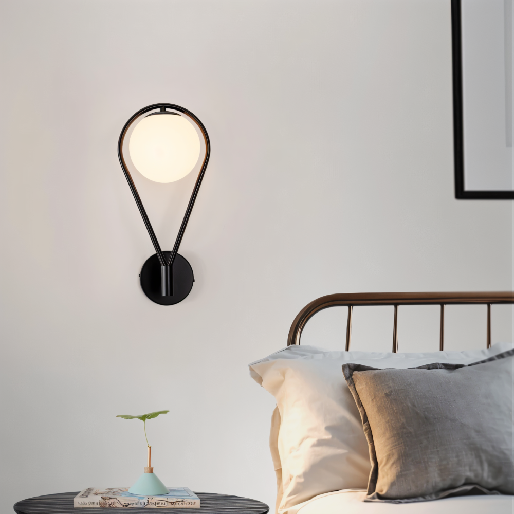 Luméa – Applique a forma di goccia in design di vetro con telaio metallico artistico