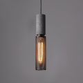 Virexo | Lampada a sospensione in cemento industriale con paralume cilindrico per interni moderni