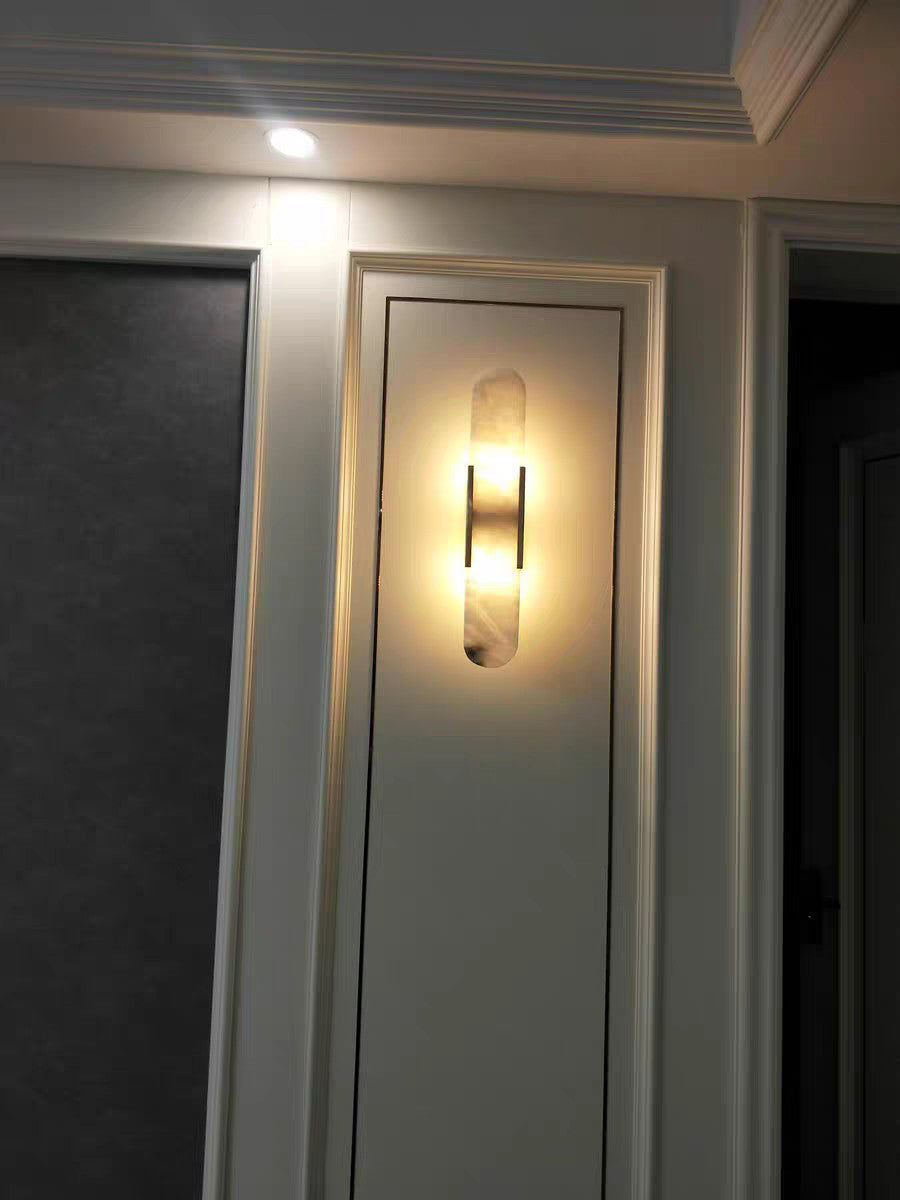 Applique da parete ovale in marmo con illuminazione ambientale LED soffusa