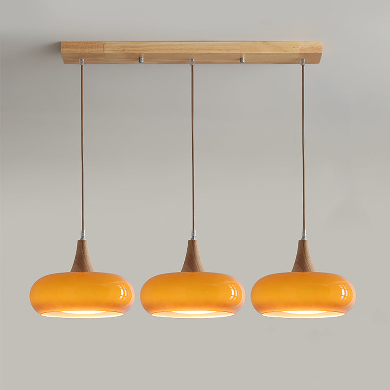Elowara | Lampada a Sospensione in Vetro Ambra con Dettagli in Legno per Illuminazione Ambientale nella Sala da Pranzo