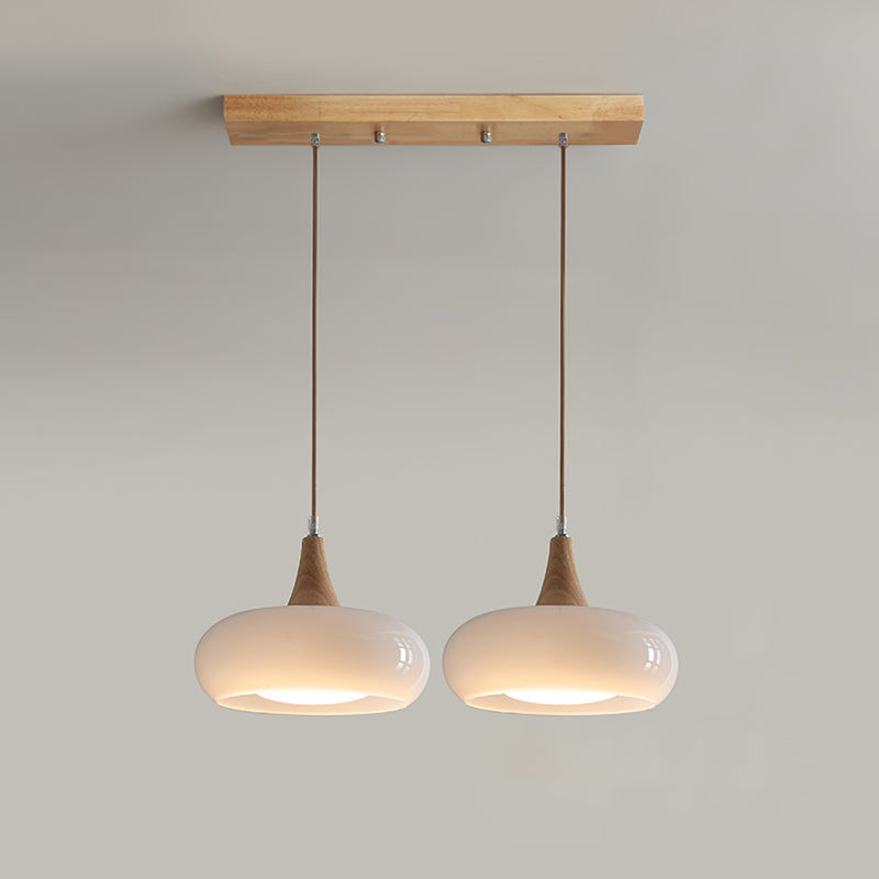 Elowara | Lampada a Sospensione in Vetro Ambra con Dettagli in Legno per Illuminazione Ambientale nella Sala da Pranzo