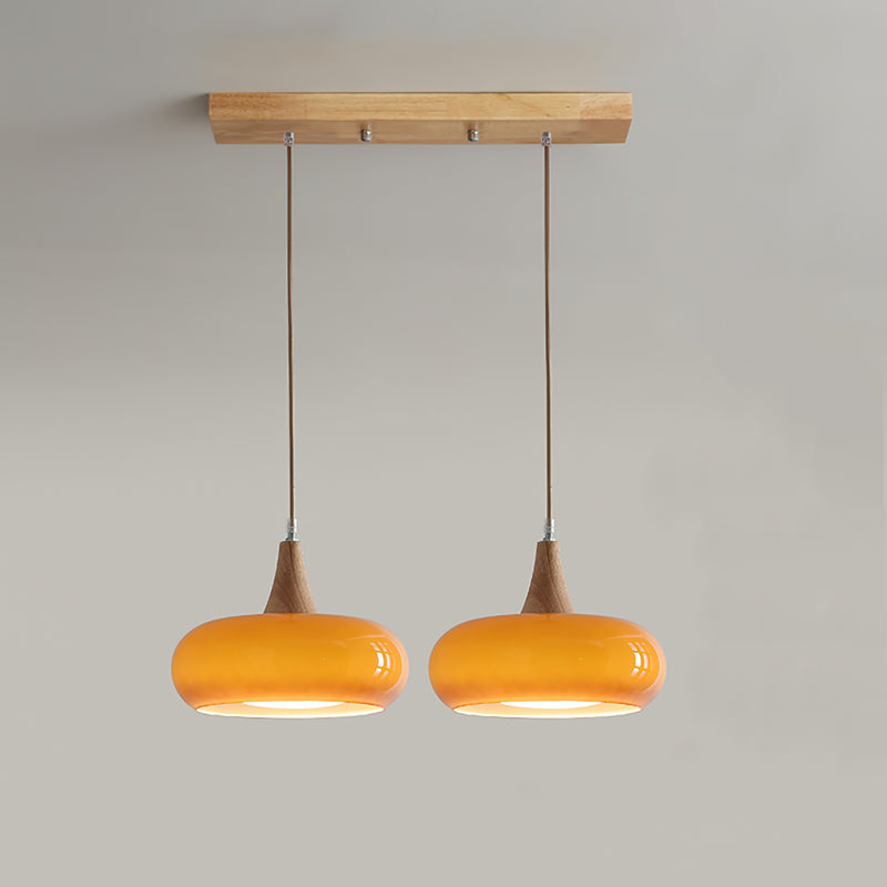 Elowara | Lampada a Sospensione in Vetro Ambra con Dettagli in Legno per Illuminazione Ambientale nella Sala da Pranzo