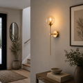 lampada da parete vintage dorata Itoy con sfera di vetro