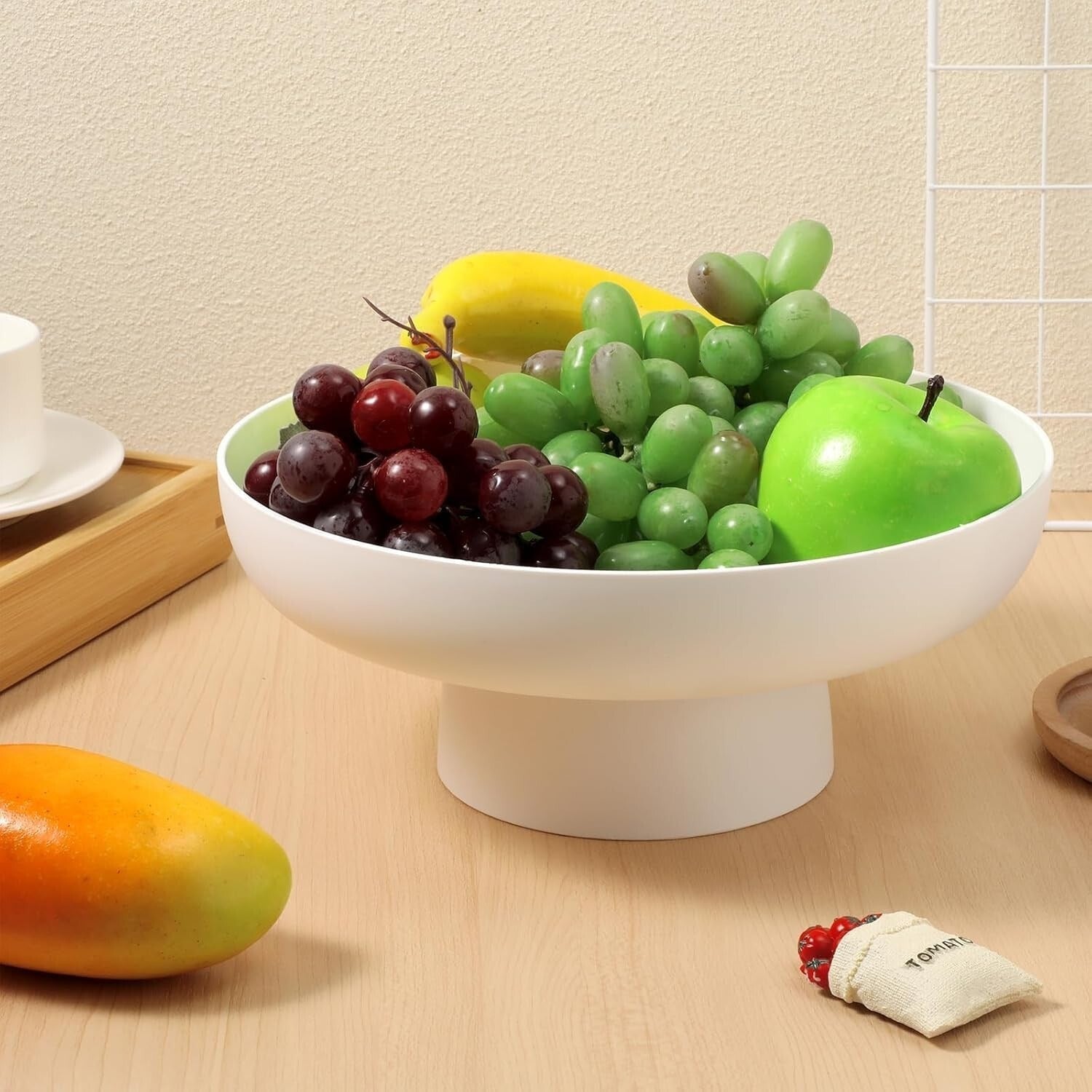 Ciotola decorativa moderna per frutta su base rialzata