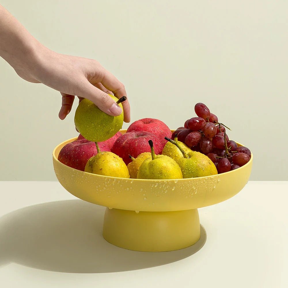 Ciotola decorativa moderna per frutta su base rialzata