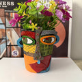 Vaso decorativo per fiori con design astratto del volto