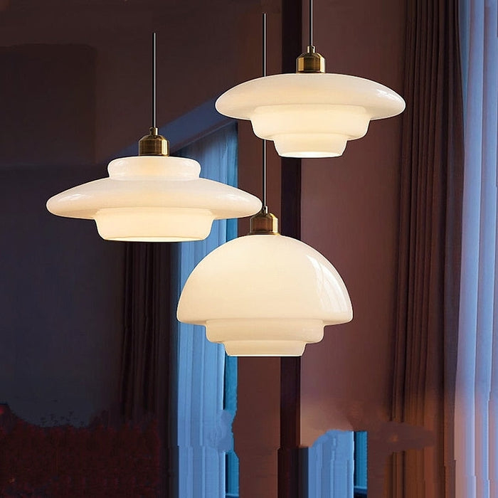 Elegant White Glass Pendant Light with Brass Fixture