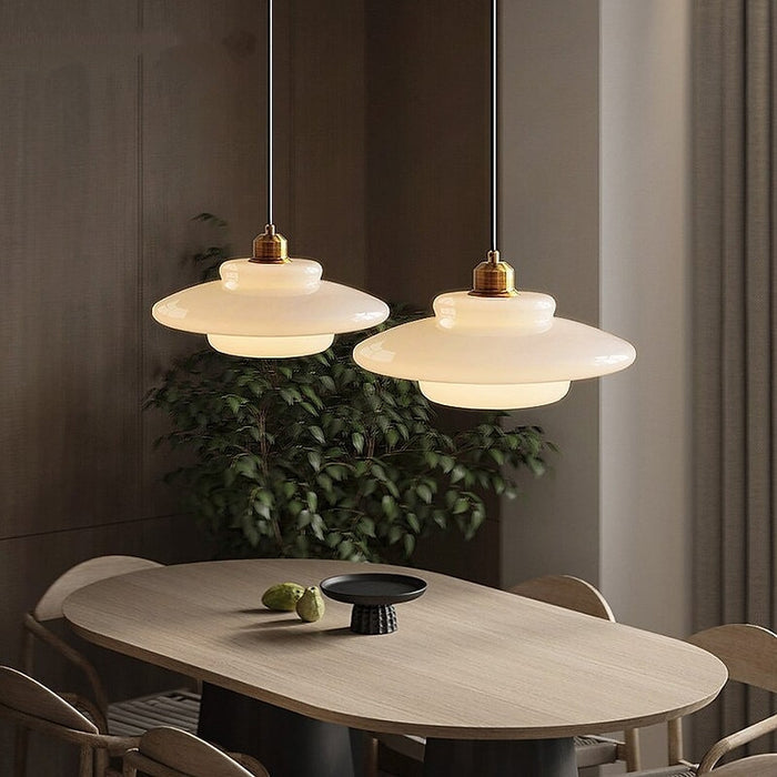 Elegant White Glass Pendant Light with Brass Fixture